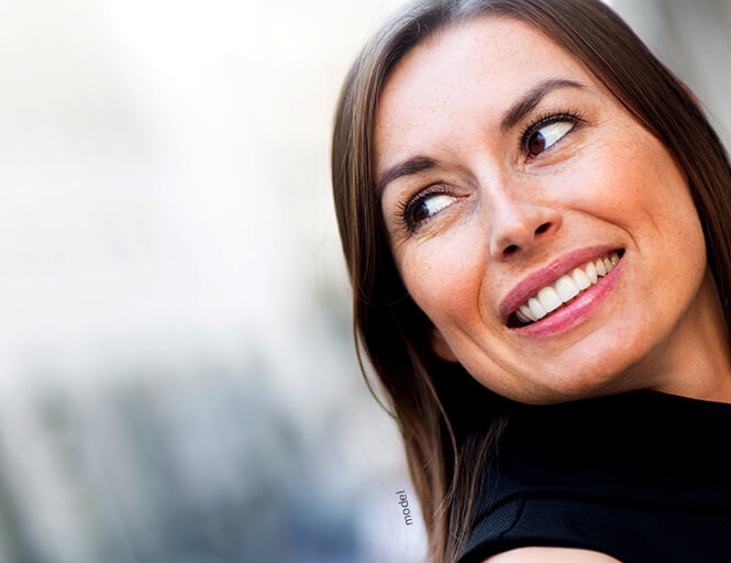 Beautiful middle aged woman looking off.