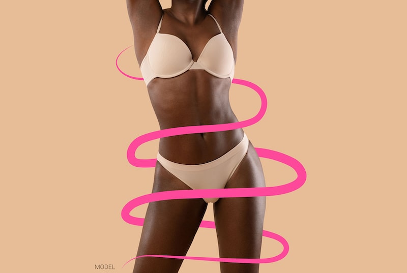 Young fit woman with pink lines surrounding her.