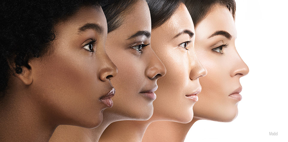 The facial profiles of four racially diverse women who all have beautiful skin