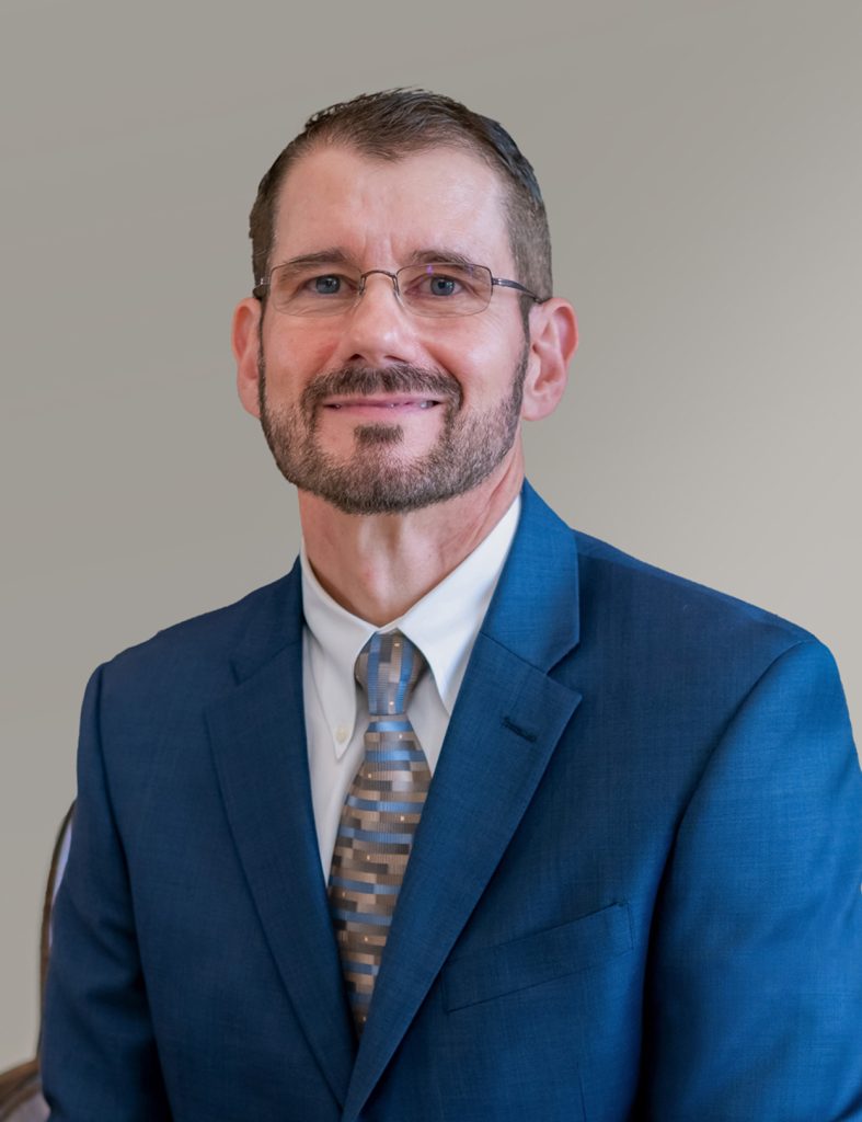 Dr. Gallas in a blue suit